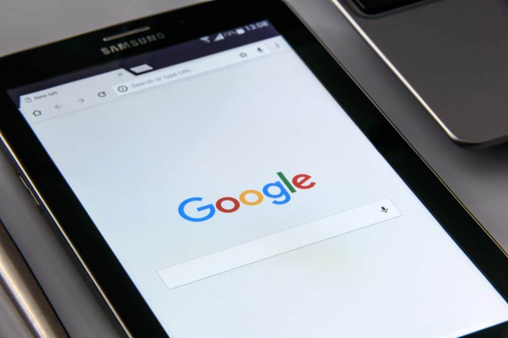 The google logo is displayed on a cell phone.